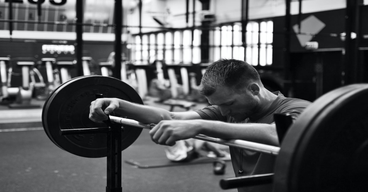 man lifting weights